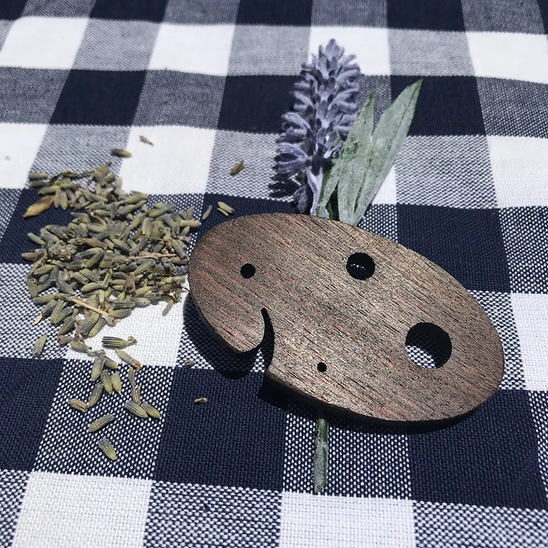Herb stripper with lavendar on picnic table