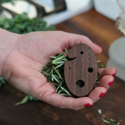 Wooden Herb Stripper with Rosemary in hands